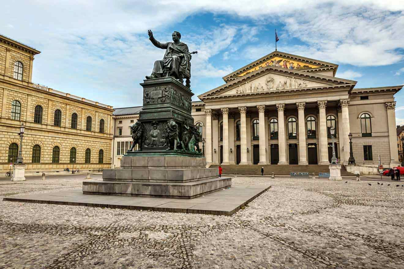 A statue of a man in front of a building.