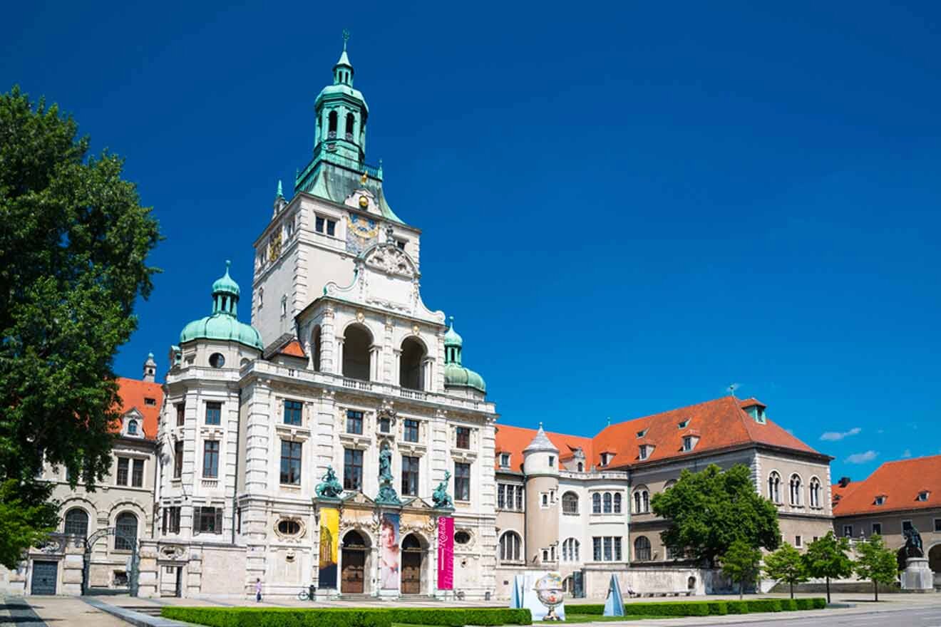 An ornate building with a clock tower in the middle.