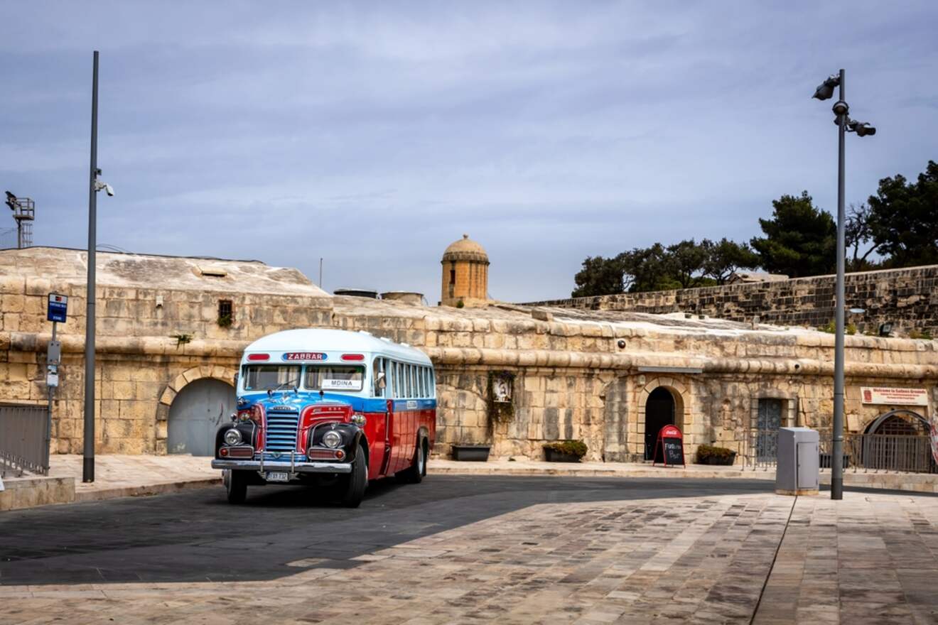 a bus parked on a street in an old city
