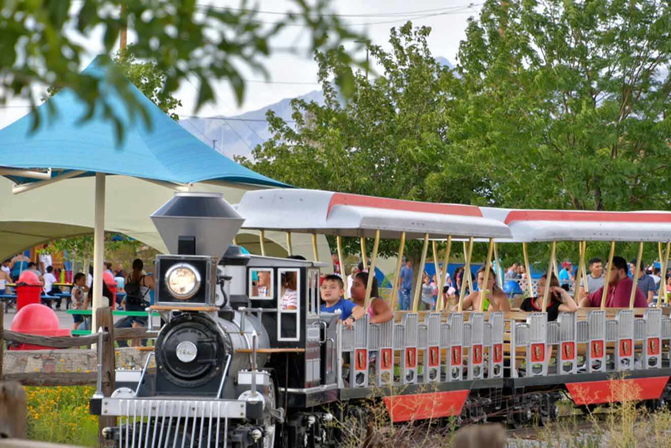 A train with people riding on it.