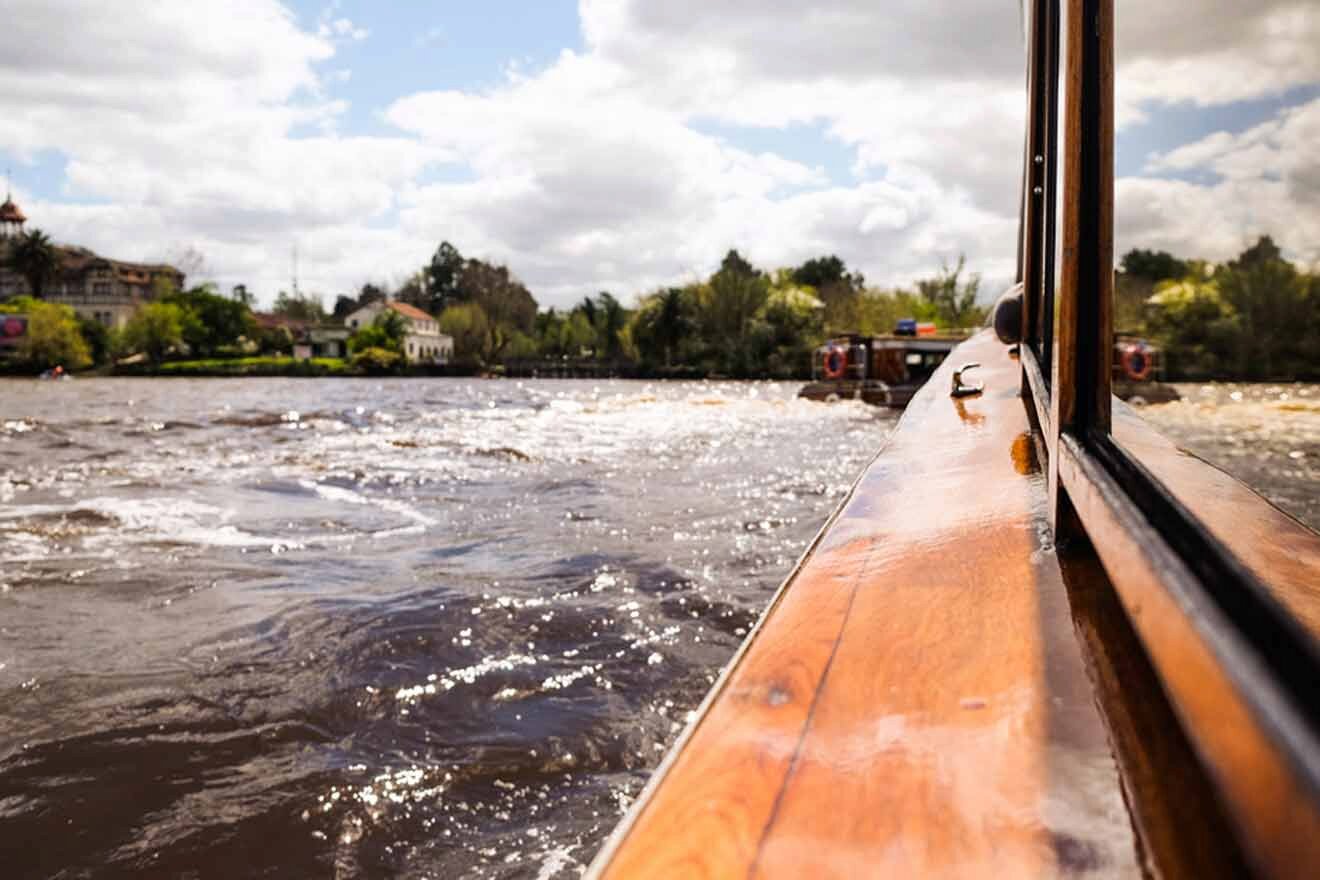 A view from the back of a boat on a river in Tigre delta