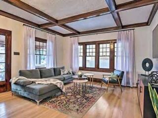 A living room with hardwood floors and a couch.