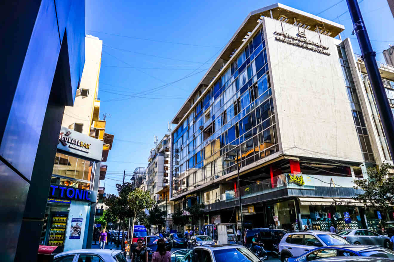 a street with buildings, shops and restaurants