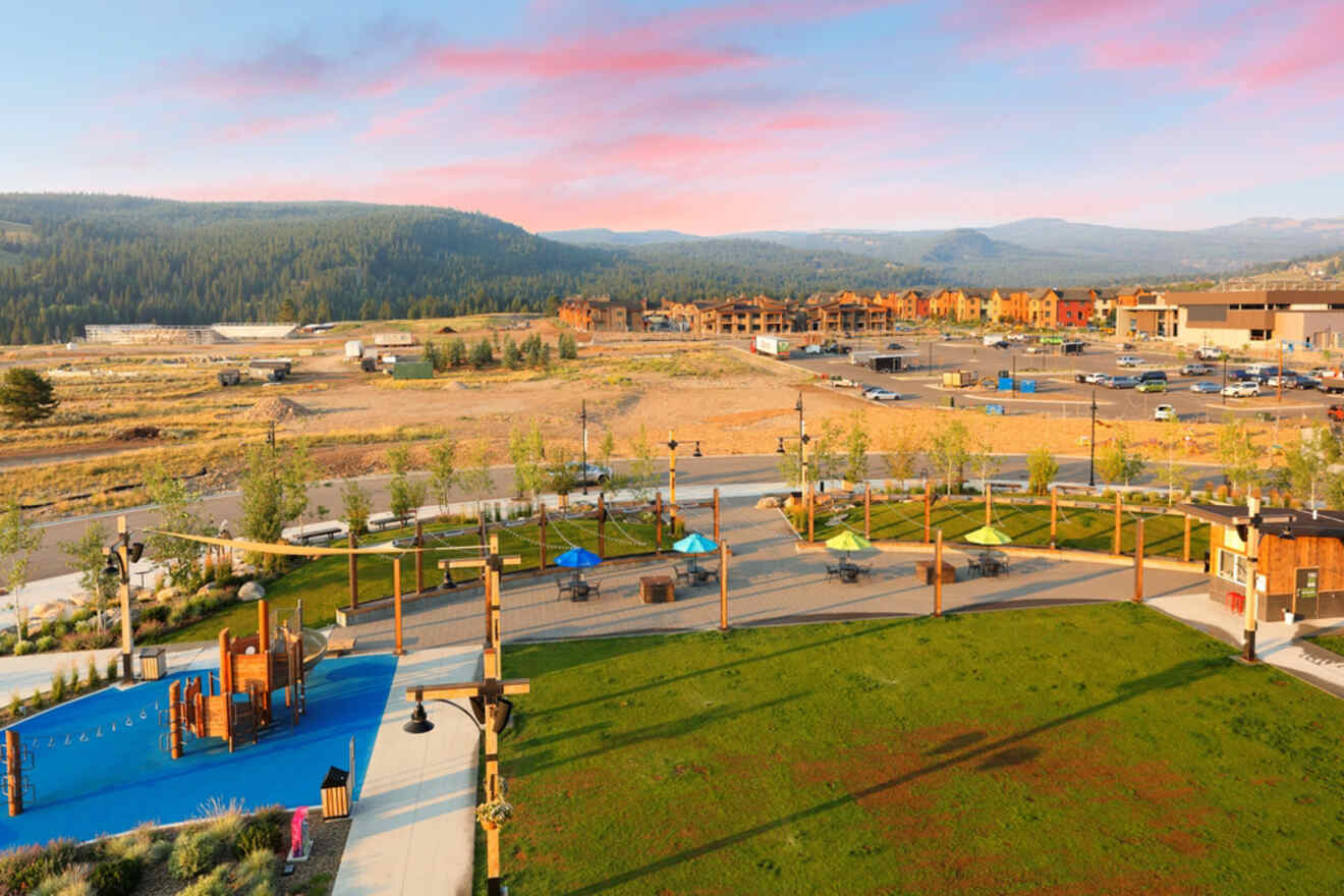 An aerial view of a playground with mountains in the background.