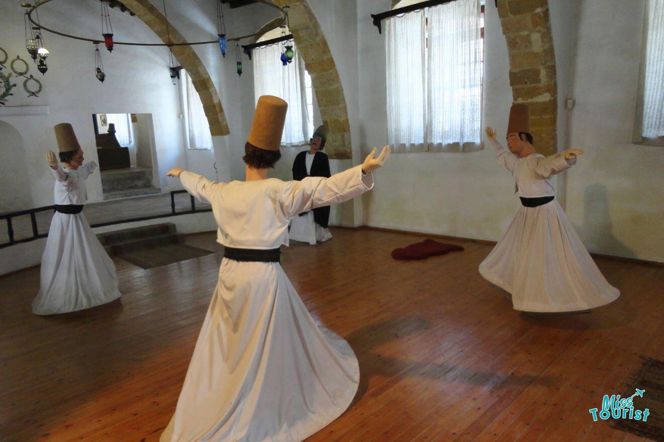 A group of people dressed in white are dancing in a museum.