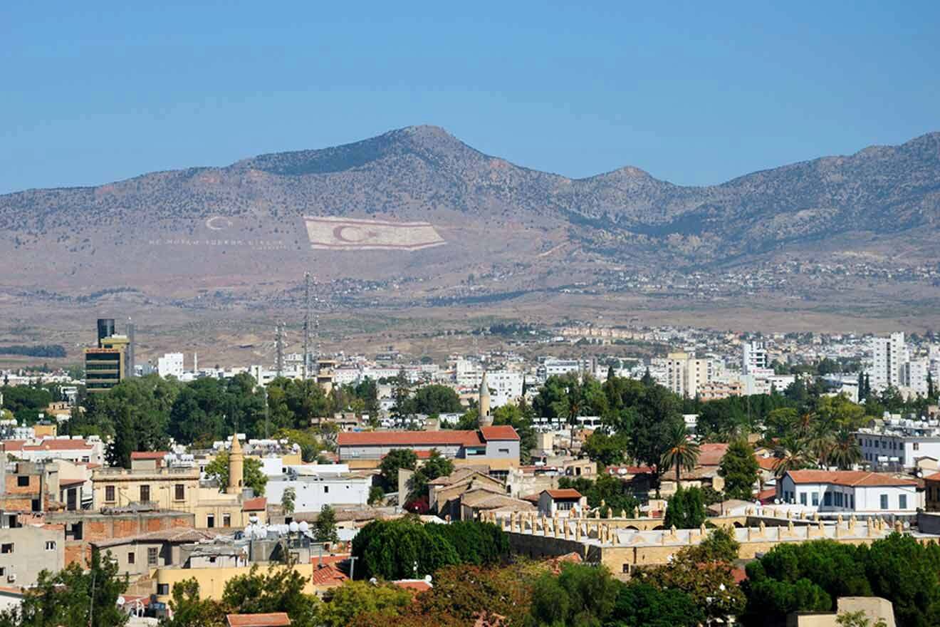 A view of a city with mountains in the background.