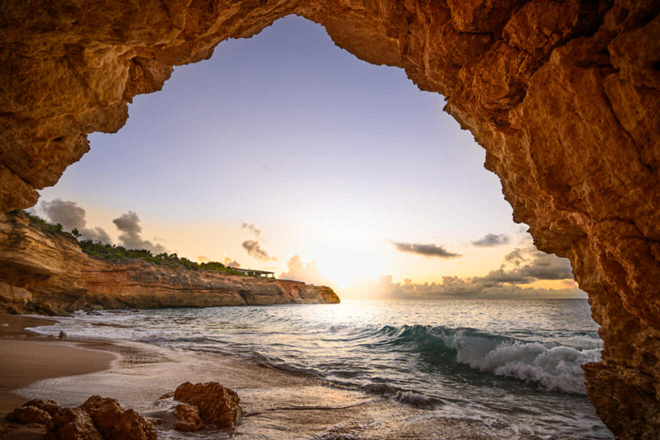 View of the ocean from a cave at sunset