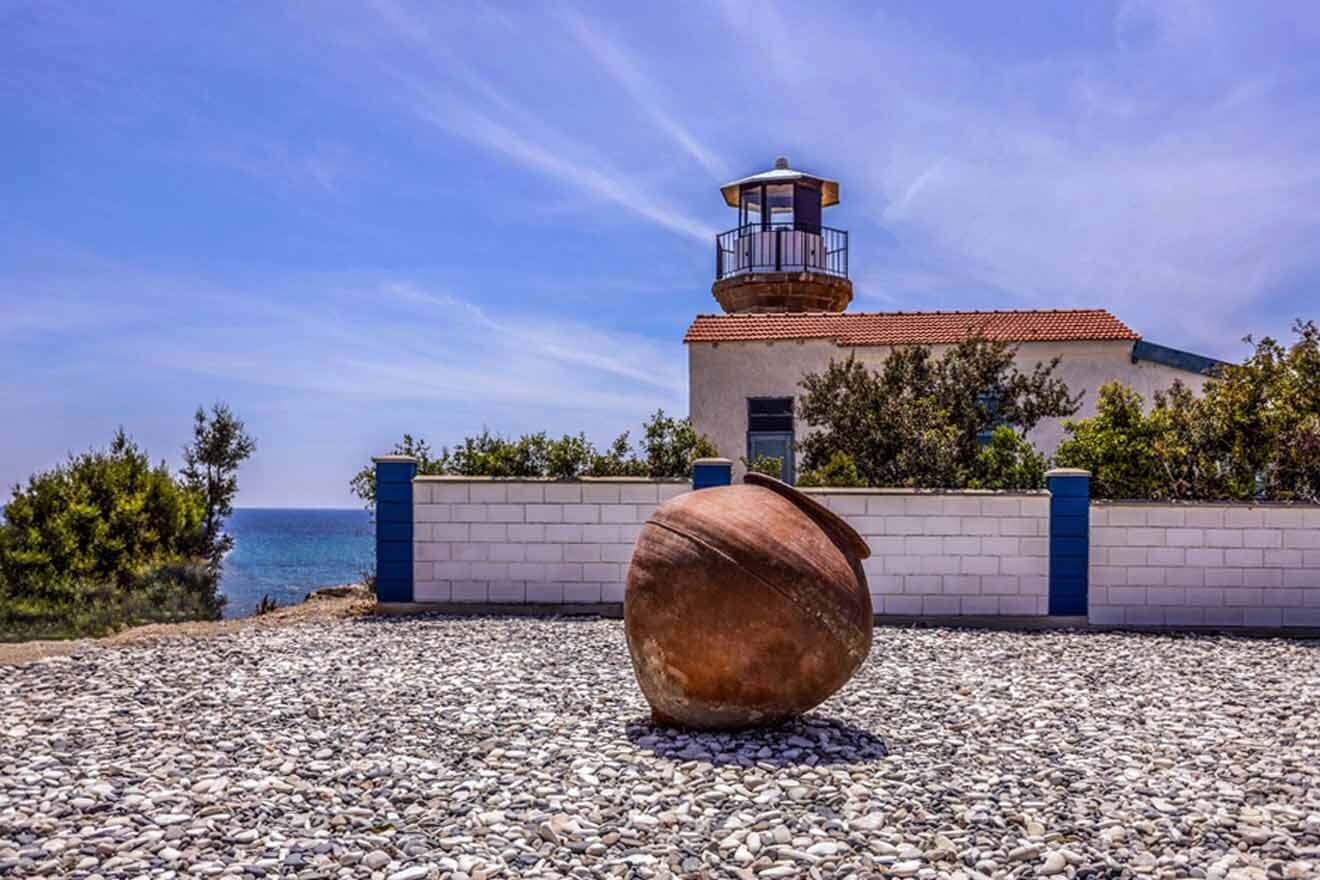 A lighthouse with a pot sitting on top of it.