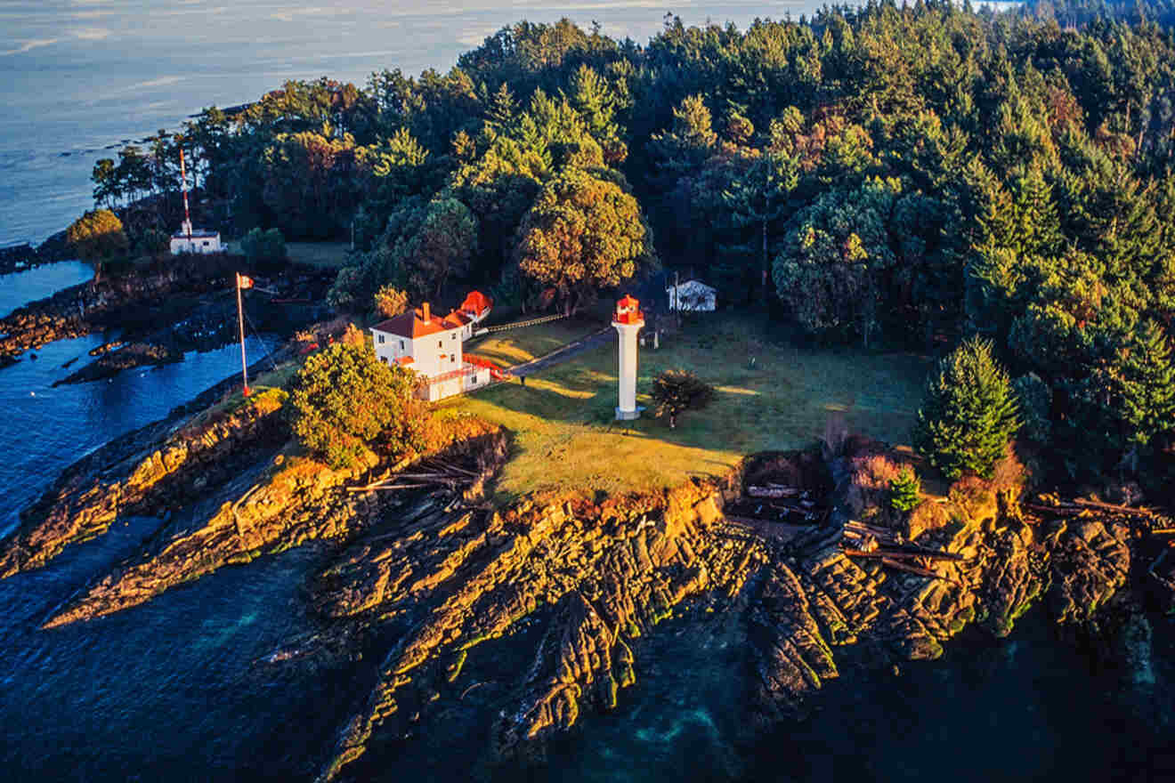 An aerial view of a lighthouse on a rocky island.
