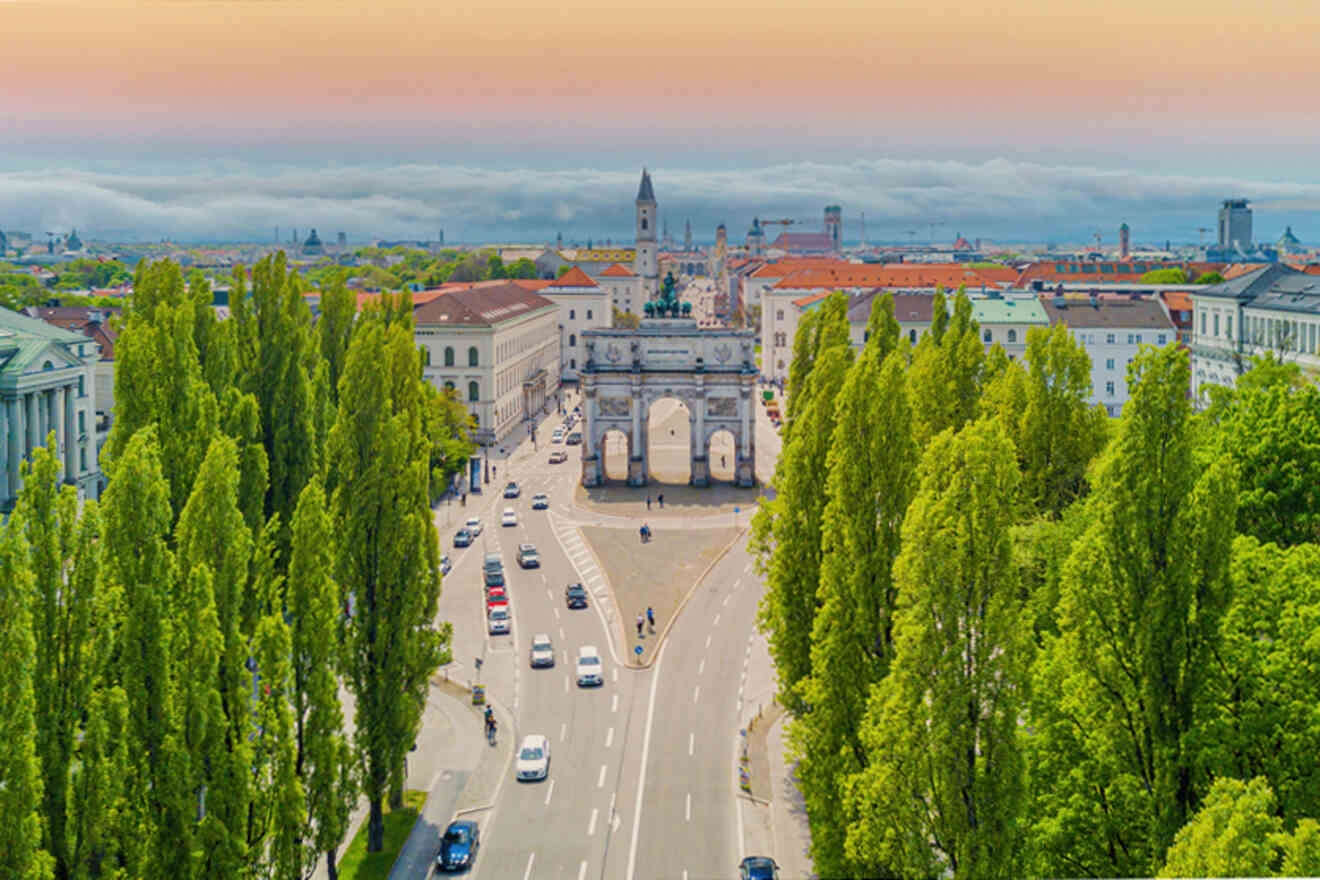 An aerial view of a city with trees in the background.