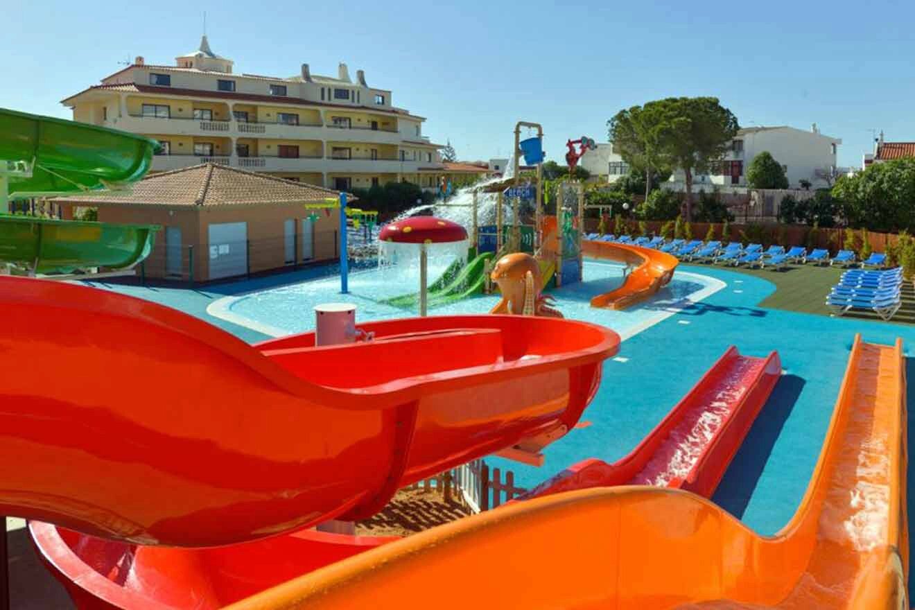 A water park with colorful slides and pools.
