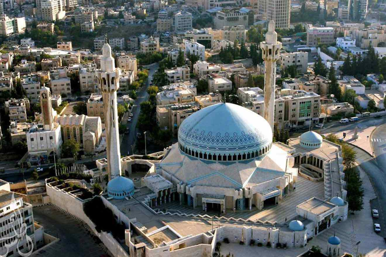 An aerial view of a mosque in the middle of a city.