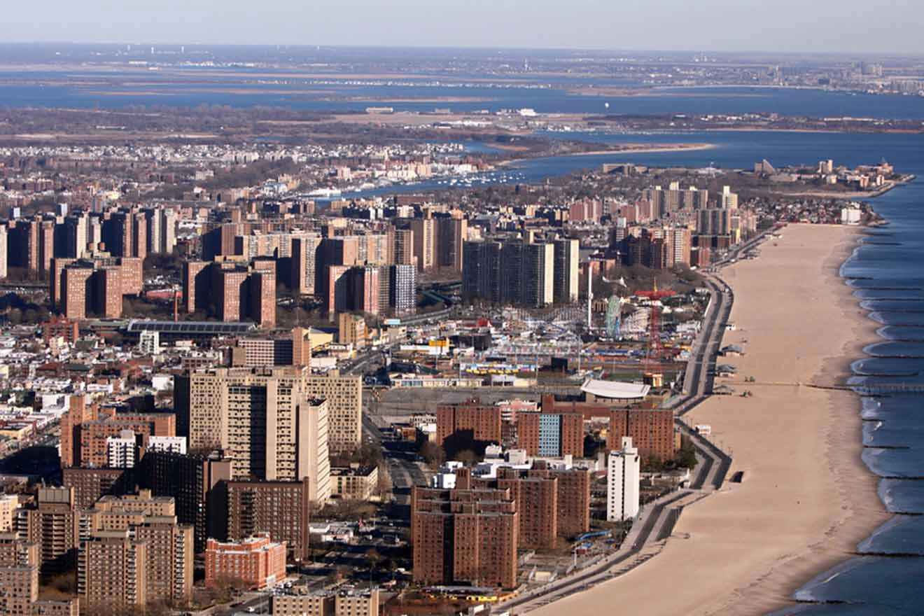 An aerial view of a city with a beach and ocean.