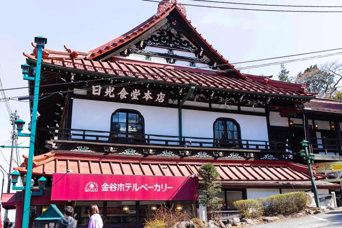 A traditional japanese building with a red roof in Nikko.
