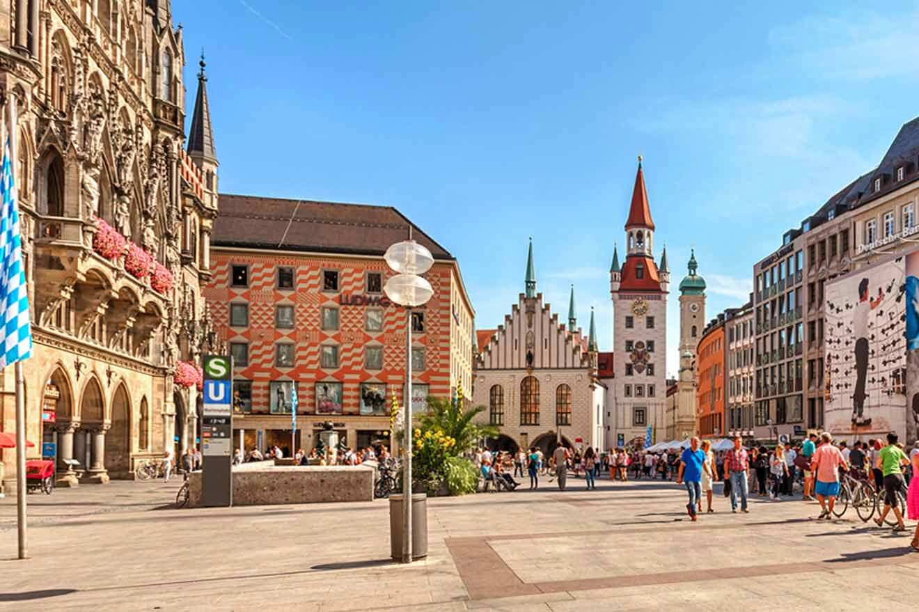 A city square in munich with many people walking around.