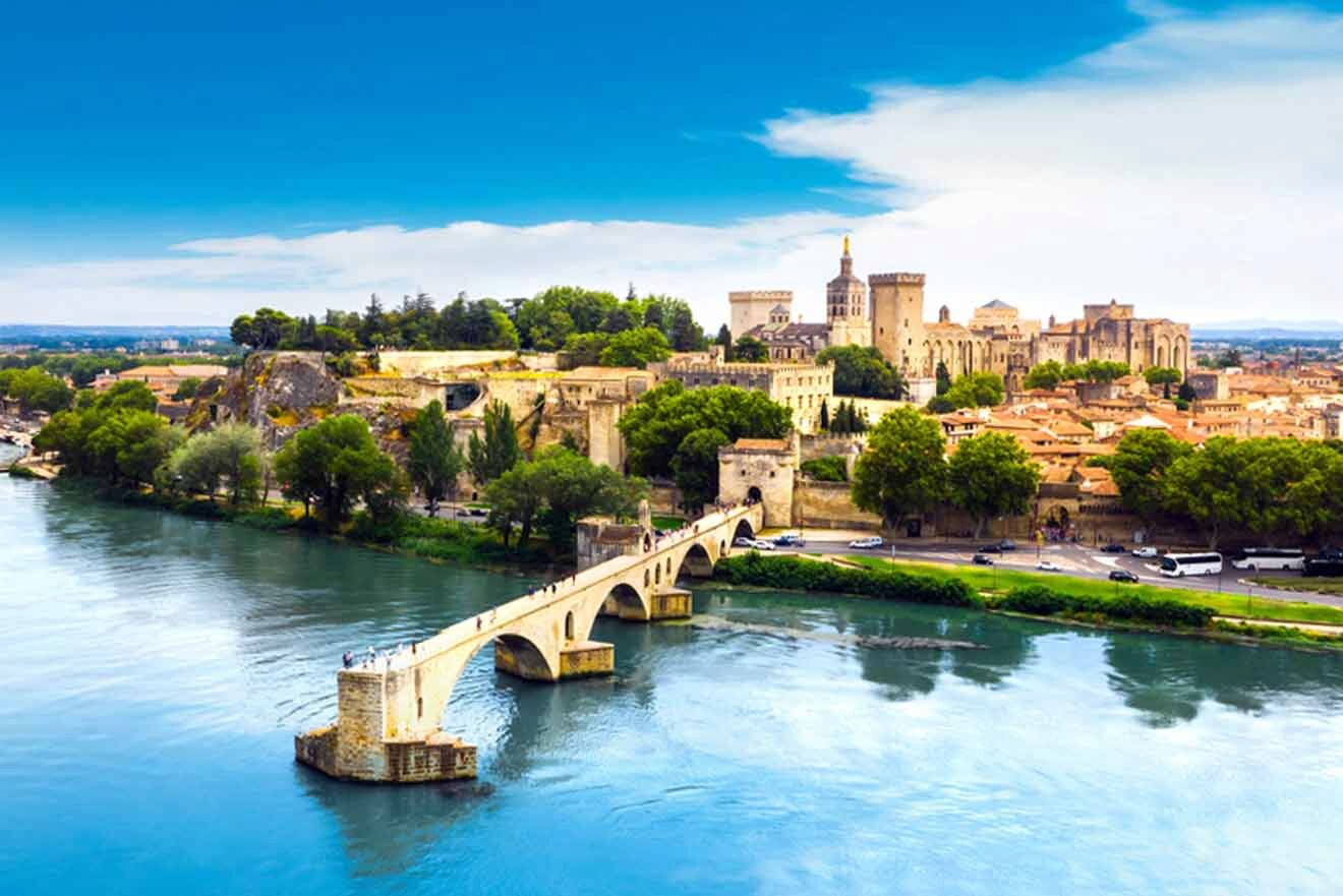 A city in france with a bridge over a river.