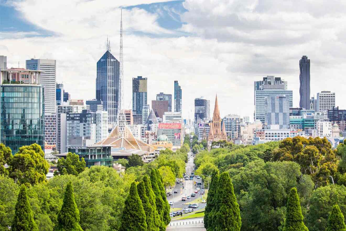 Melbourne skyline with trees and buildings in the background.