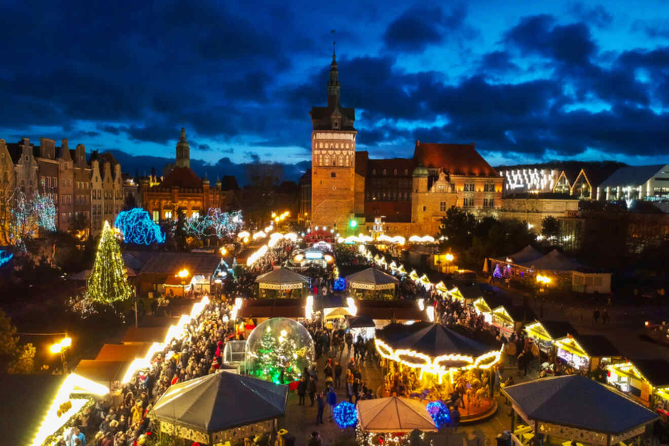 aerial view of a Christmas market with wooden stalls at night