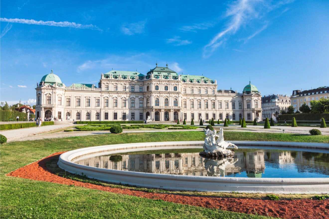 The Belvedere royal palace in vienna, austria with a fountain in front of the building