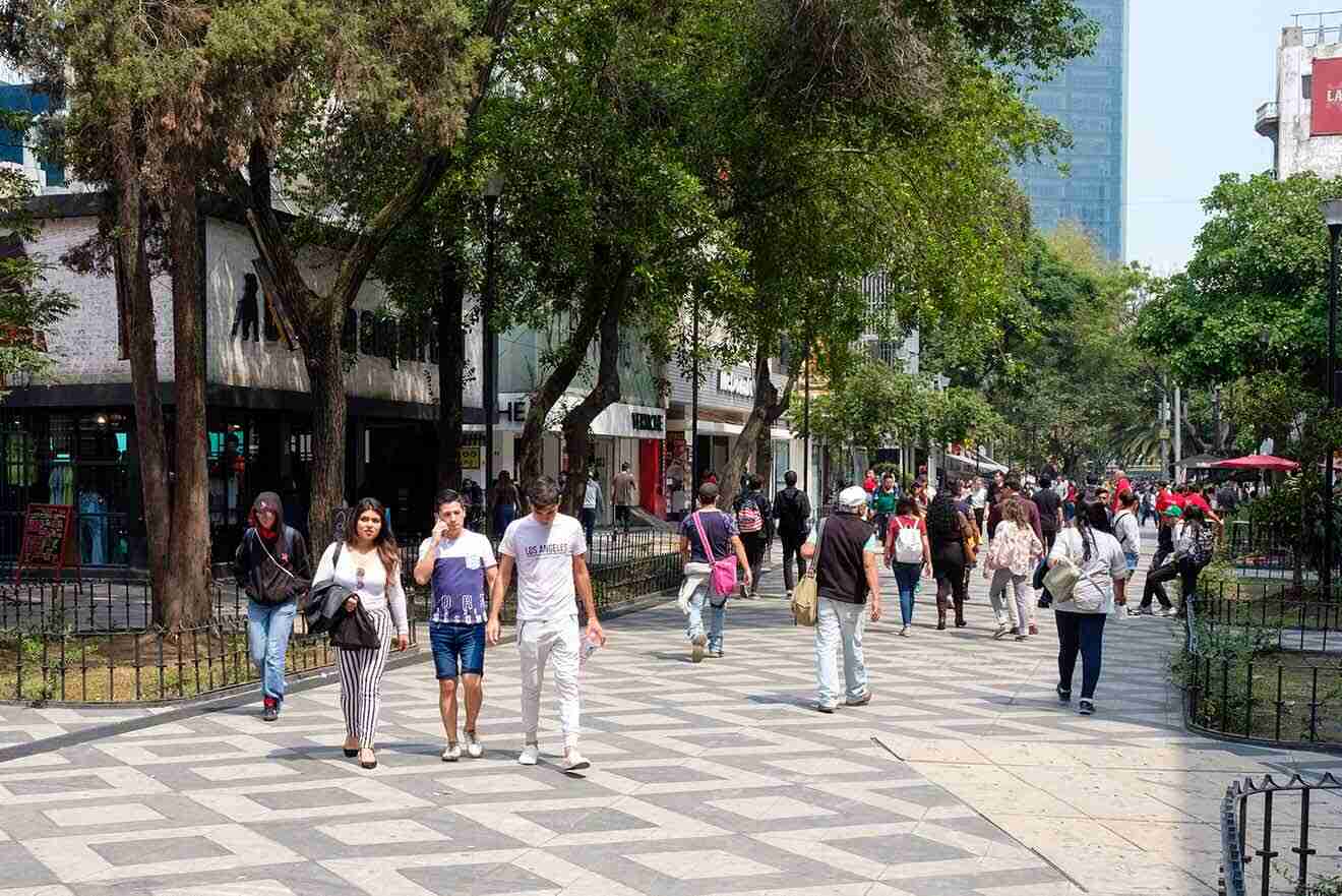 People walking on a sidewalk in the area of Juarez, Zona Rosa, Mexico City