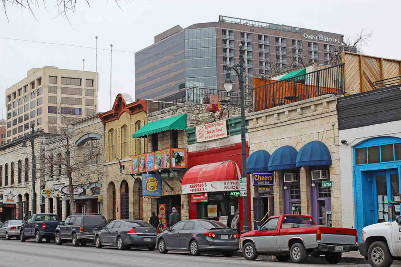 Cars parked on 6th Street in front of bars and restaurants in Austin, Texas