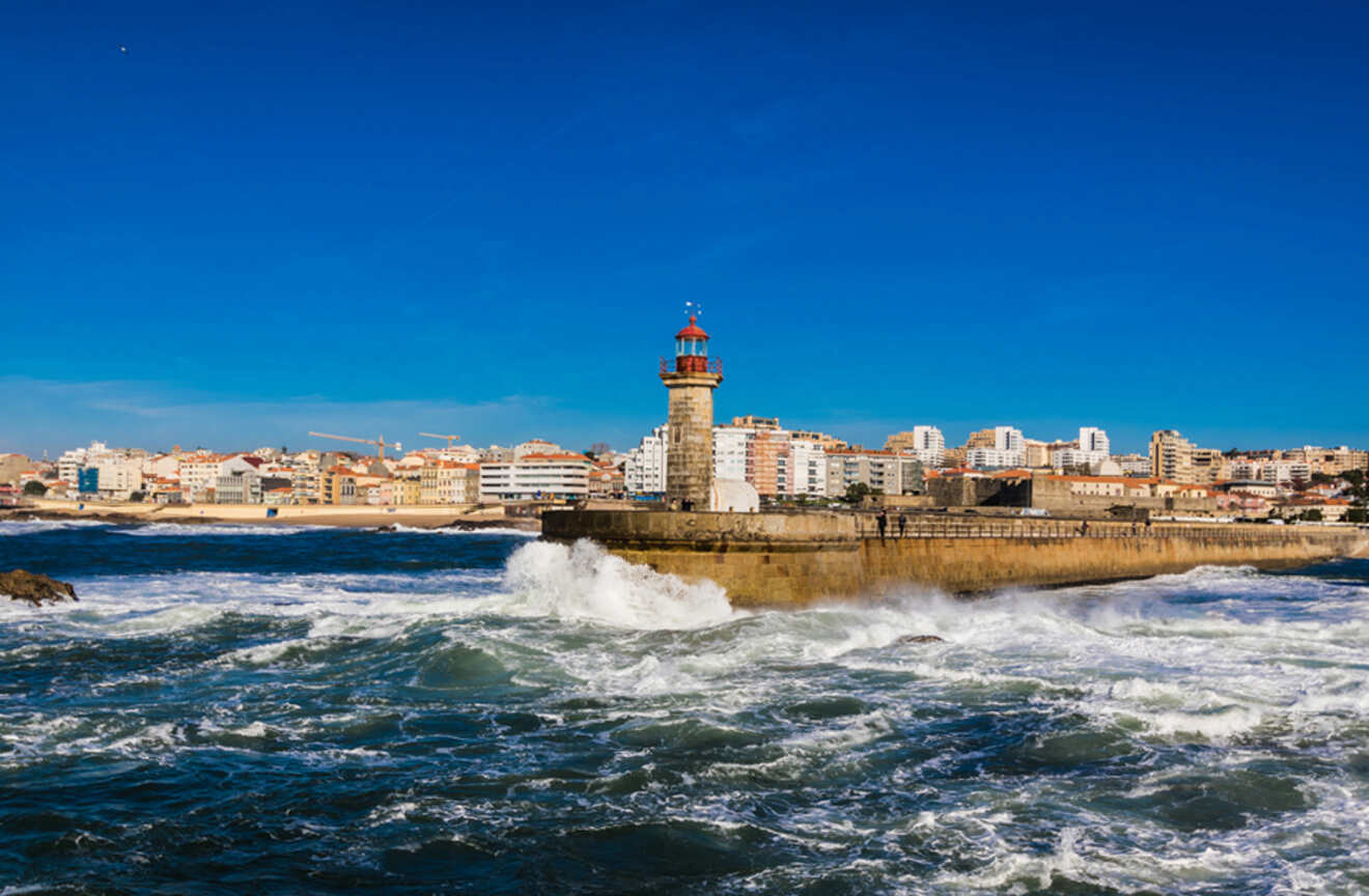 The historic Farolim de Felgueiras lighthouse in Porto, standing resilient against the crashing waves of the Atlantic Ocean