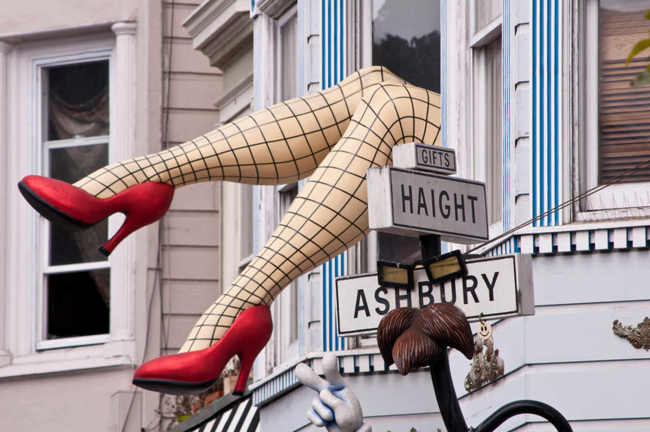Whimsical and iconic, a pair of large dangling legs protrude from a building in the Haight-Ashbury district, capturing the eclectic and historic vibe of the area.