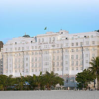 The historic and luxurious Copacabana Palace hotel facade, a grand white building in Rio de Janeiro, Brazil