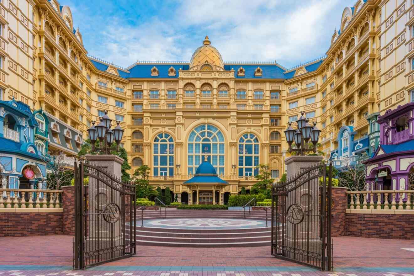 The opulent facade of Tokyo Disneyland Hotel with its Victorian-style architecture and gated entrance
