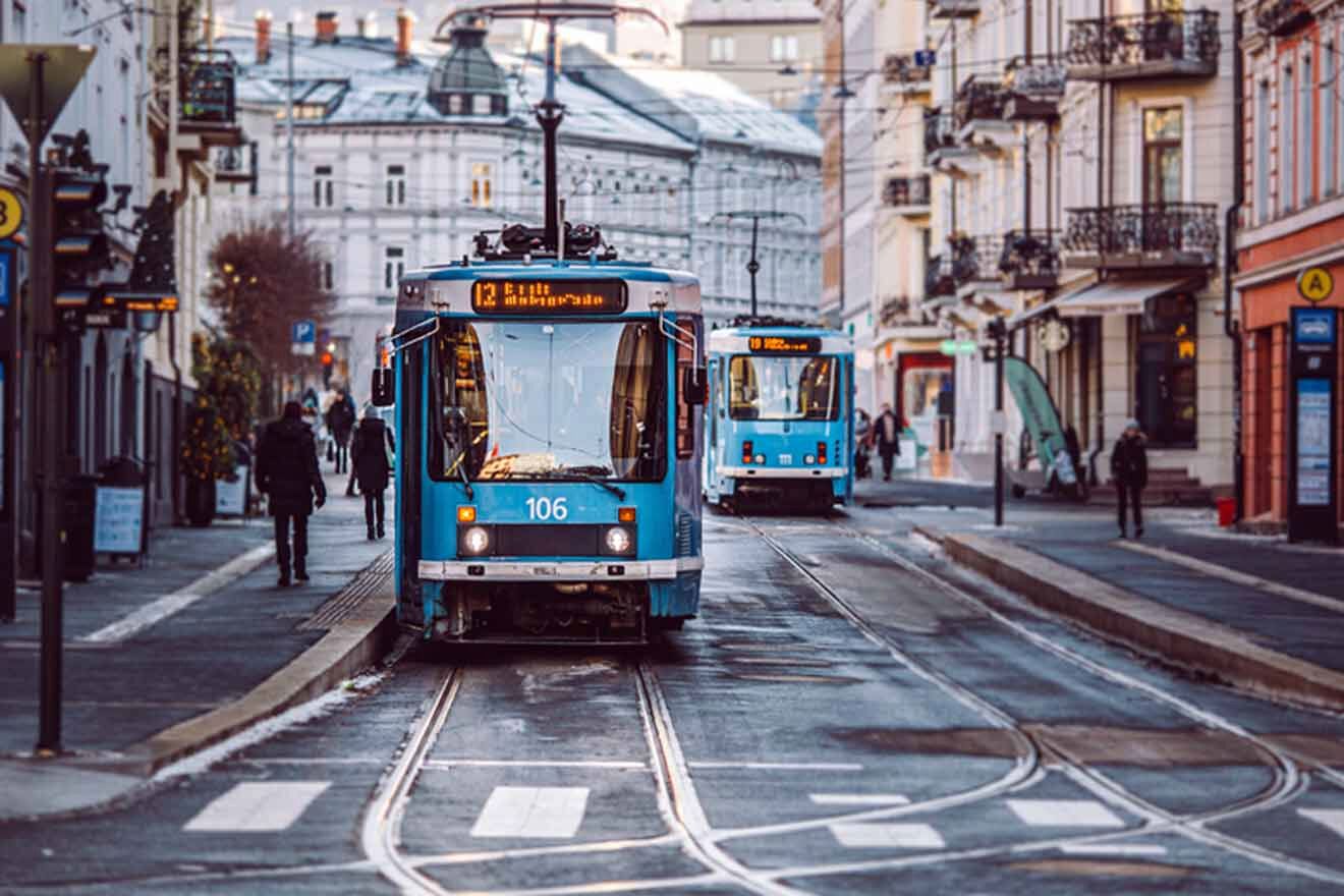 Early evening street scene in Oslo with trams on the move, highlighting urban transport amidst the charming backdrop of city life.