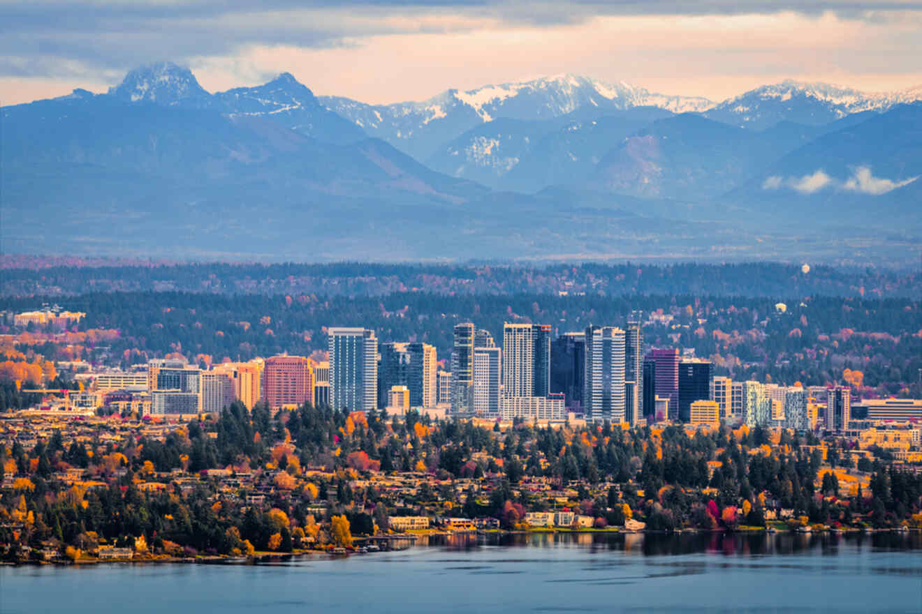Aerial perspective of Bellevue, Washington, highlighting its cityscape with high-rise buildings and mountainous backdrop during fall