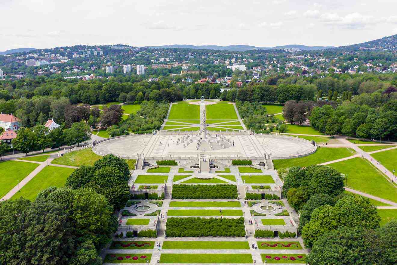 Aerial view of Vigeland Sculpture Park in Oslo showing the radial paths, green landscaping, and the Monolith in the distance.