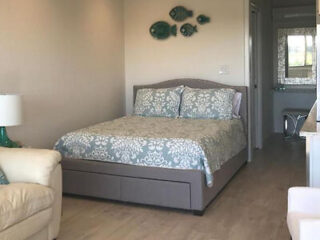 Cozy bedroom interior at Ocean Vista Resort, featuring a queen bed with patterned bedding