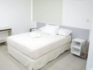 Compact and clean bedroom in Hostal Ibrais, Panama, featuring essential amenities for a comfortable stay