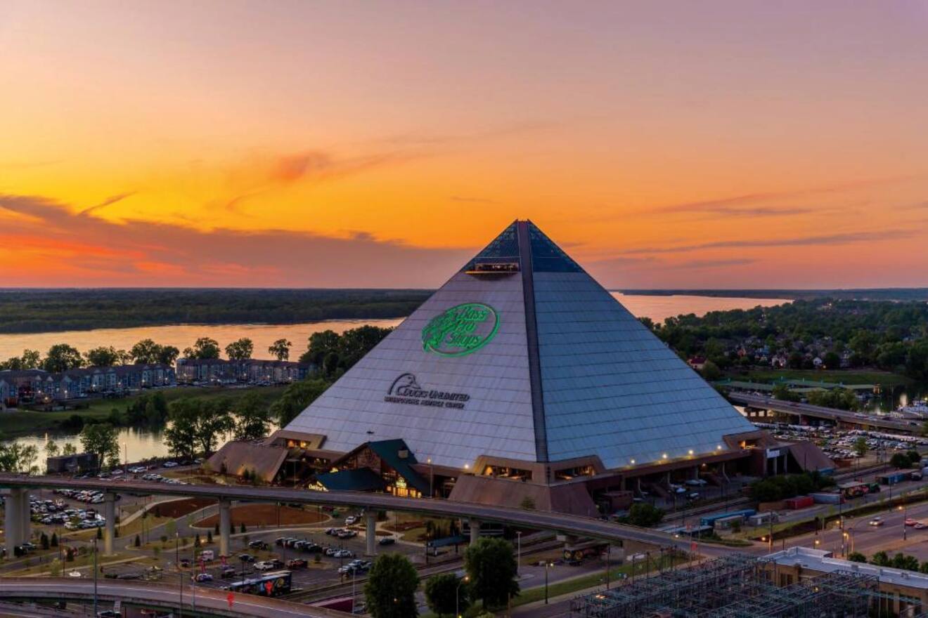 Sunset view of the Pyramid in Memphis, now a mega retail and entertainment complex, with the Mississippi River and a dramatic sky in the backdrop