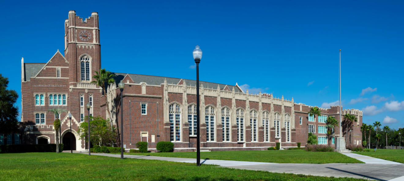 Historic brick building of Plant Hall at the University of Tampa with clear blue skies
