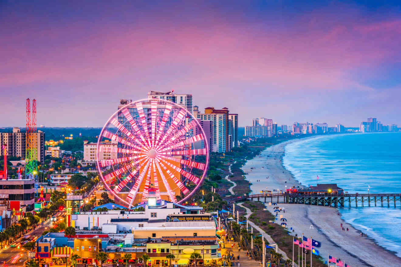 Myrtle Beach skyline at dusk with a lit Ferris wheel, coastal hotels, and a beautiful sunset over the ocean