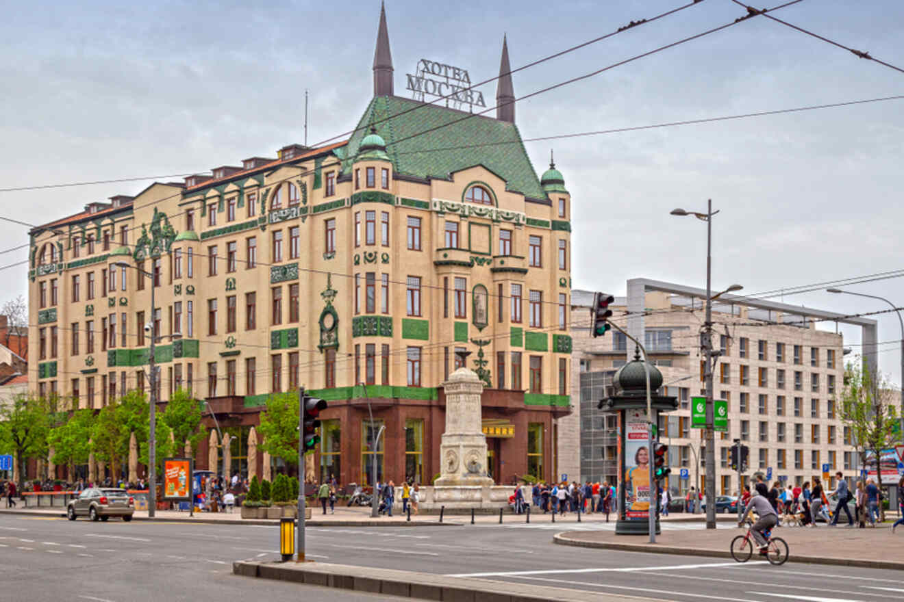 Facade of Hotel Moskva in Belgrade, an example of Art Nouveau architecture with its ornate green and white exterior and distinctive green roof