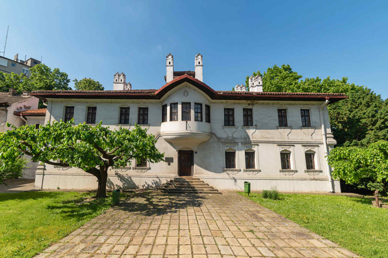 Front view of the Residence of Princess Ljubica in Belgrade, showing its traditional Balkan architectural style with white walls and a terracotta roof
