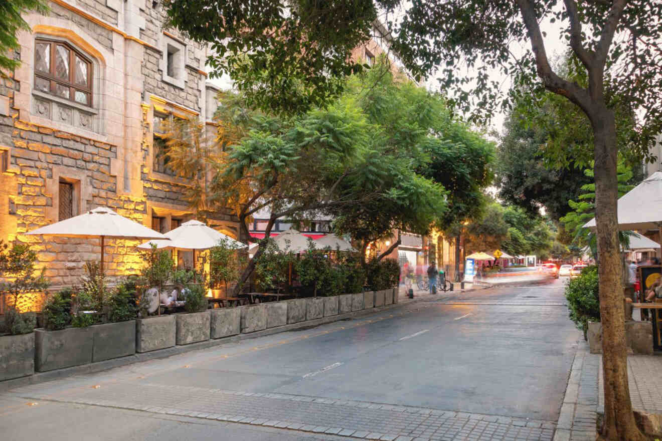 Twilight scene of the bustling Lastarria neighborhood in Santiago, Chile, with outdoor dining and warm ambient lighting