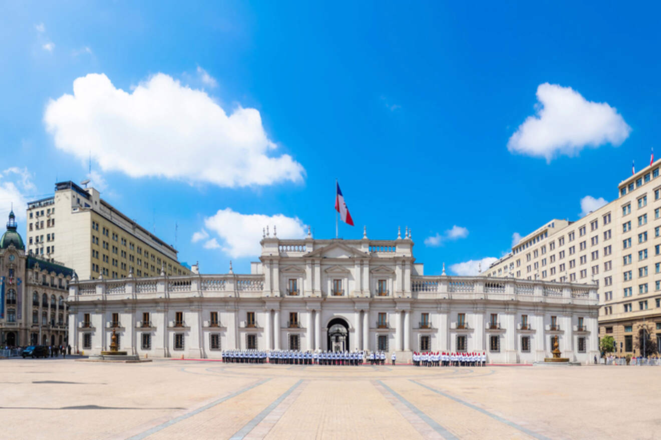 The grand Palacio de la Moneda, Chile's presidential palace, with its neoclassical architecture and symmetrical design on a sunny day in Santiago