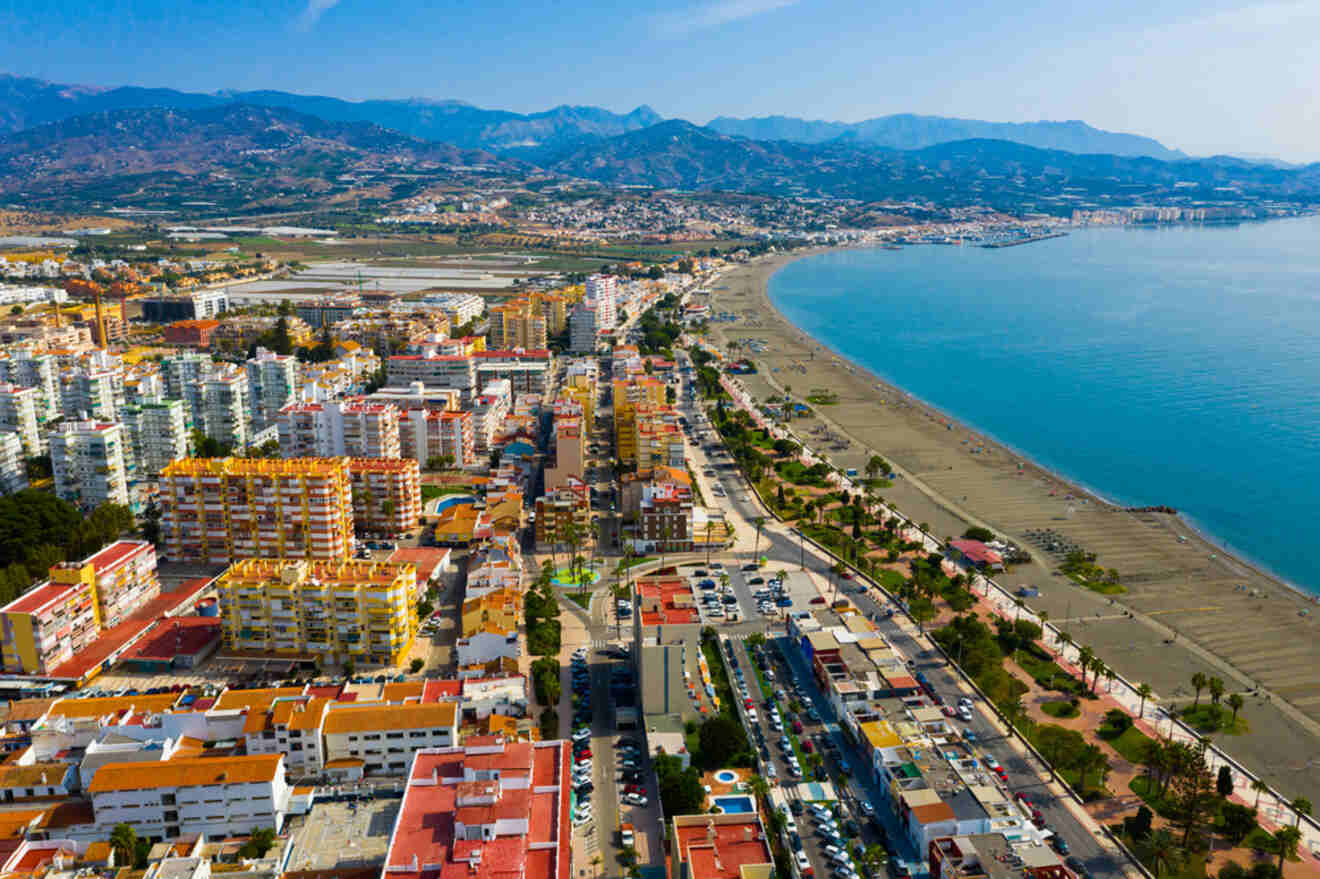 Aerial shot of Torre del Mar, Málaga, with urban architecture lining the extensive beach