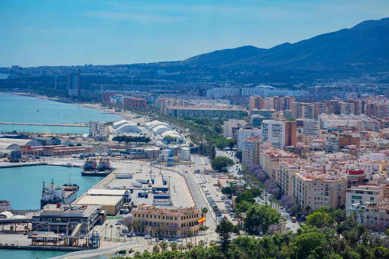 Western Coast of Málaga, displaying a bustling urban beach with cityscape and mountain views