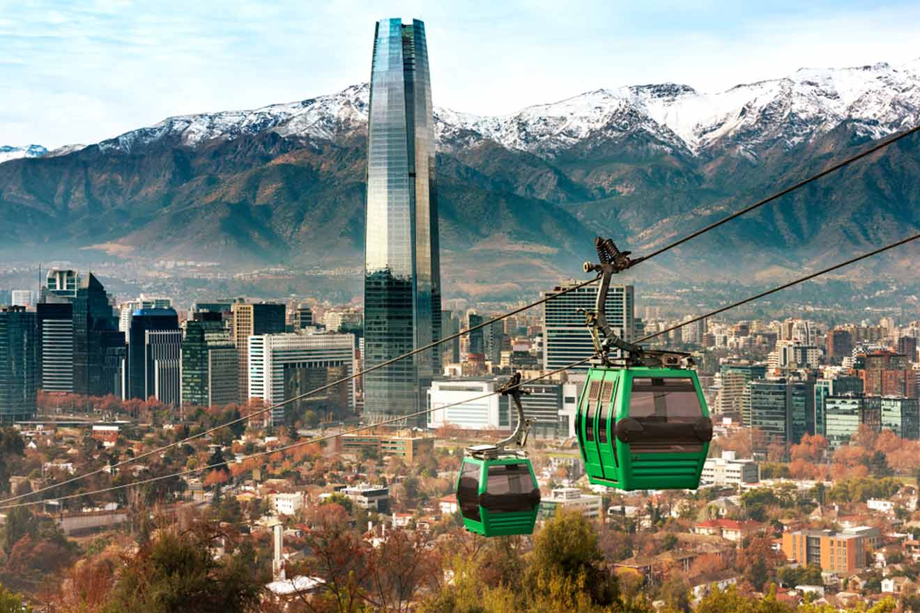 The San Cristobal Hill cable car offering panoramic views of Santiago, Chile, with the Gran Torre Santiago skyscraper standing tall against the backdrop of the snow-capped Andes Mountains