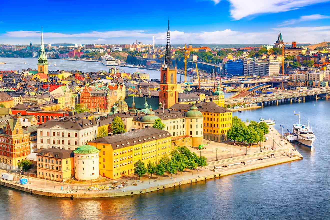 Aerial view of Stockholm's historic Gamla Stan with colorful buildings and boats along the waterfront
