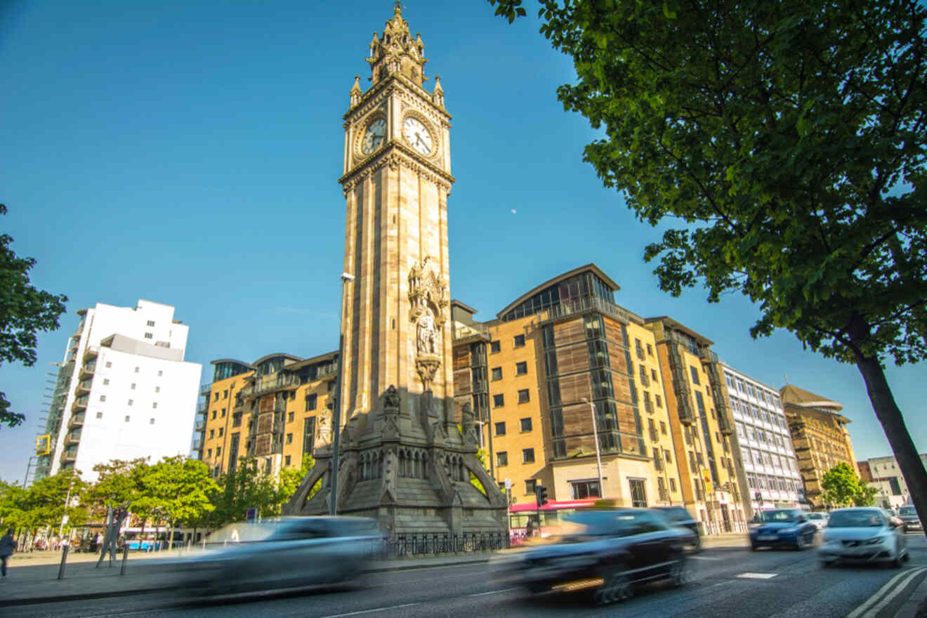 The iconic Albert Memorial Clock in Belfast, with motion blur of passing vehicles emphasizing the city's dynamic nature