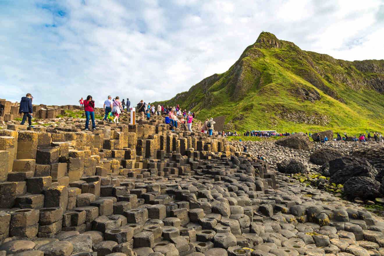 Belfast's famous Giant's Causeway, showcasing the unique hexagonal volcanic rock formations with tourists exploring