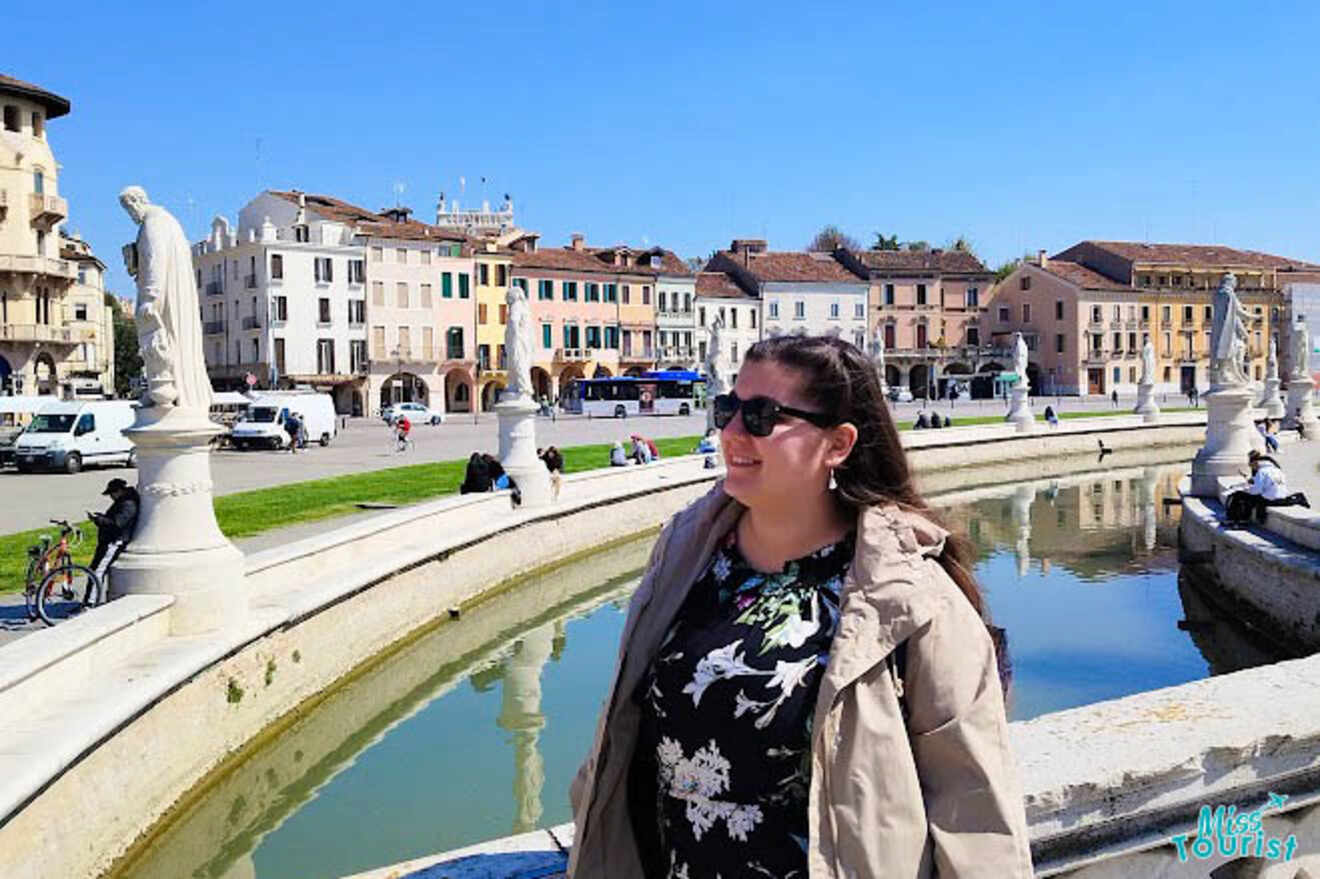 The writer of the post standing by the statue-lined Prato della Valle in Padua, under a bright blue sky