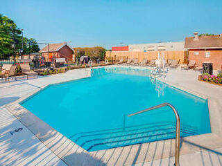 Inviting outdoor swimming pool at Residence Inn Richmond with ample lounging chairs