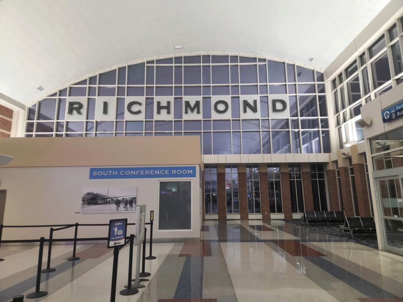 Spacious interior of Richmond airport with large windows spelling 'RICHMOND,' providing a bright and modern gateway to the city
